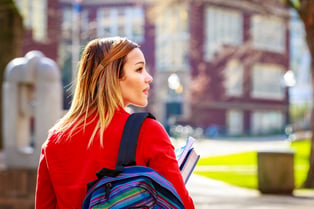 Student Walking Through College Campus