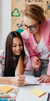 Girl working with teacher